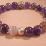 Close-up of smooth amethyst beads with rich purple hues