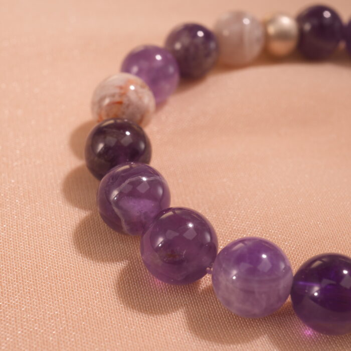 Close-up of smooth amethyst beads with rich purple hues