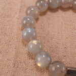 Close-up of natural moonstone beads showing texture and sheen