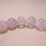 Close-up of amethyst bead texture showing soft purple hues