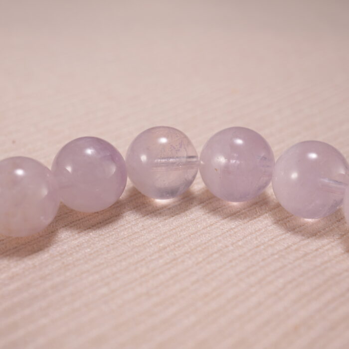 Close-up of amethyst bead texture showing soft purple hues