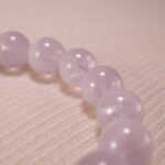 Close-up of amethyst bead texture showing soft purple hues