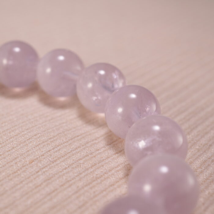 Close-up of amethyst bead texture showing soft purple hues