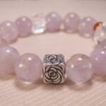 Close-up of transparent quartz beads and soft purple amethyst