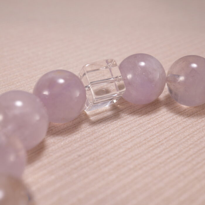 Close-up of transparent quartz beads and soft purple amethyst