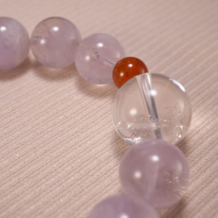 Close-up of transparent quartz beads and soft purple amethyst