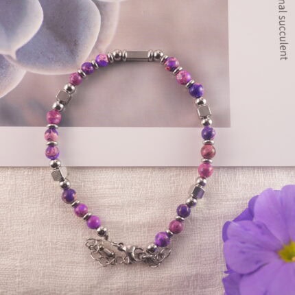 The bracelet placed in a calm, softly lit natural setting suggesting evening tranquility