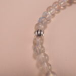 Close-up view of moonstone beads with natural shimmer and fine polish