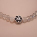 Close-up view of moonstone beads with natural shimmer and fine polish