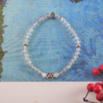 The bracelet resting in a serene natural environment, evoking peaceful energy