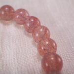 Close-up of Strawberry Quartz Beads, Pearls and Flower Charm – Elegant Handmade Bracelet