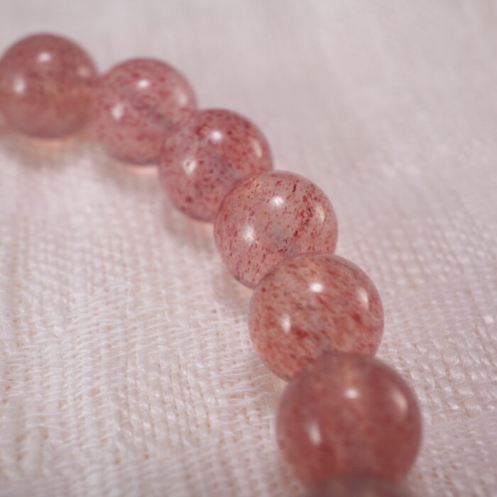 Close-up of Strawberry Quartz Beads, Pearls and Flower Charm – Elegant Handmade Bracelet