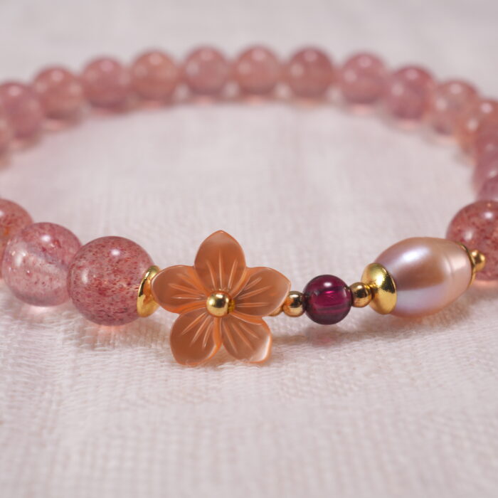 Close-up of Strawberry Quartz Beads, Pearls and Flower Charm – Elegant Handmade Bracelet