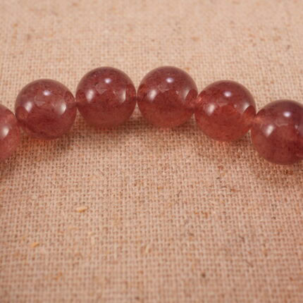 Close-up of Strawberry Quartz Beads and Heart Charm – S925 Gemstone Bracelet