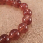 Close-up of Strawberry Quartz Beads and Heart Charm – S925 Gemstone Bracelet