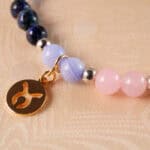 Close-up of Taurus Zodiac Bracelet showing green aventurine, red agate, rose quartz, sodalite, and Taurus charm