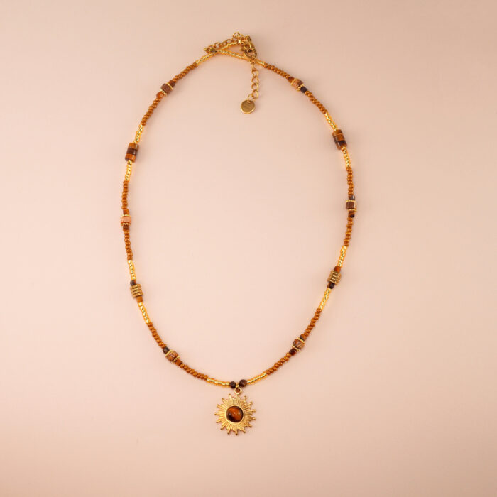 Handmade tiger eye bead necklace with sunflower pendant on white background