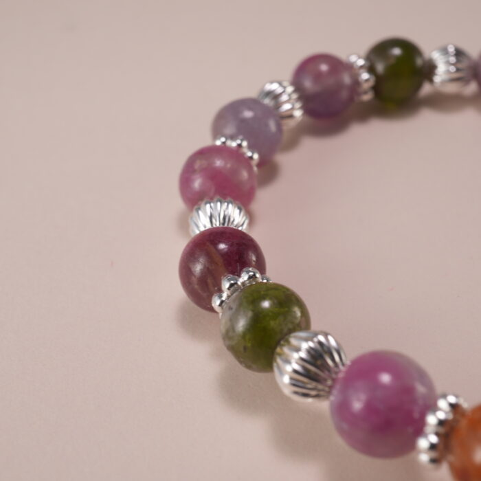 Close-up of Multicolor Tourmaline Beads and Silver Cross Charm