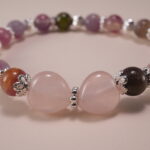 Close-up of Multicolor Tourmaline Beads and Silver Cross Charm