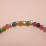 Close-up of Tourmaline Beads and Silver Charms – Vibrant Charm Bracelet