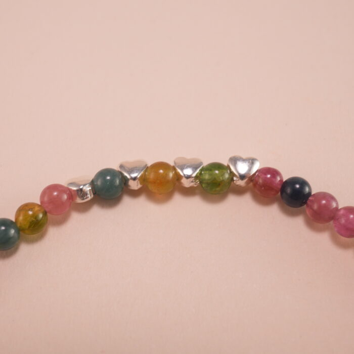 Close-up of Tourmaline Beads and Silver Charms – Vibrant Charm Bracelet