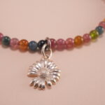 Close-up of Tourmaline Beads and Silver Charms – Vibrant Charm Bracelet