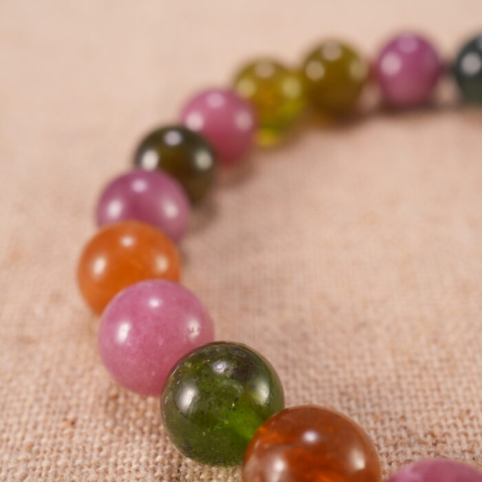 Close-up of Multicolor Tourmaline Beads and Sterling Silver Cross Charm