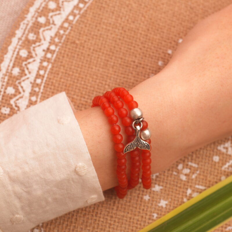 Red Agate 4mm stacking bracelet worn on wrist, layered with minimalist jewelry