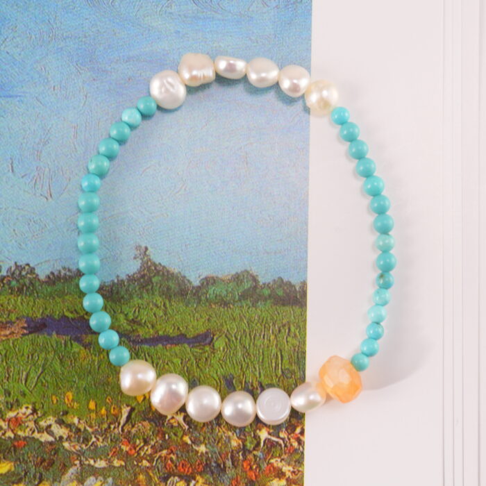Healing bracelet with turquoise and pearls in natural light