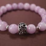 Close-up of kunzite beads showing natural texture and soft color variations