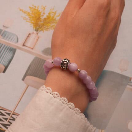 Worn on wrist to highlight the gentle color and polished 8mm beads