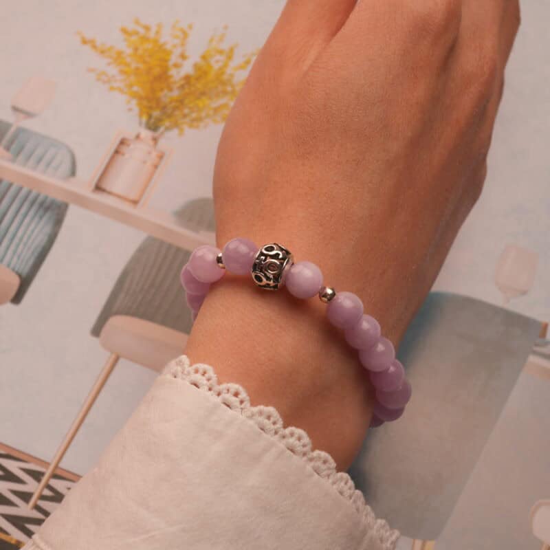 Worn on wrist to highlight the gentle color and polished 8mm beads