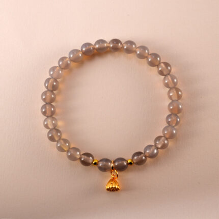 6mm agate charm bracelet with handmade details on neutral background