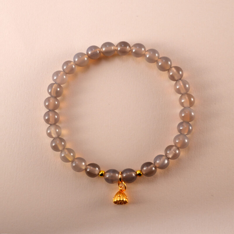 6mm agate charm bracelet with handmade details on neutral background