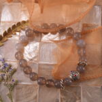 Bracelet placed in a serene, natural setting with soft lighting