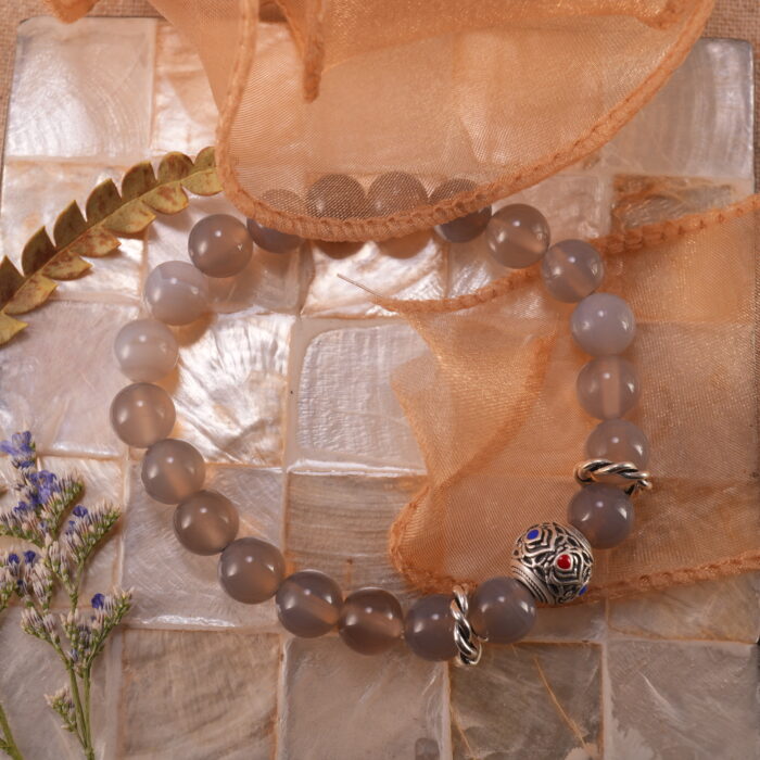 Bracelet placed in a serene, natural setting with soft lighting