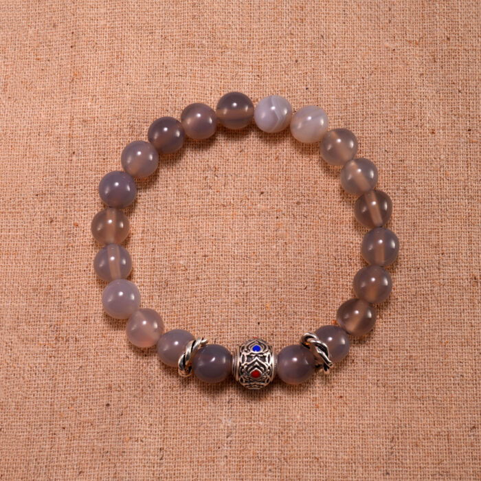 Handmade 8mm agate gemstone bead bracelet displayed on clean background