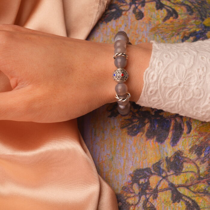 8mm agate bracelet styled on wrist for a grounded, elegant look