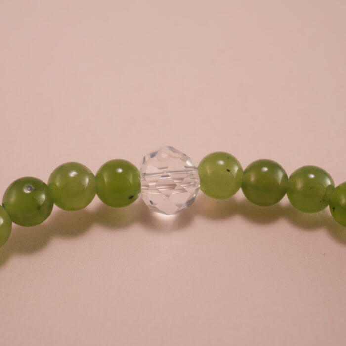 Close-up showing green chalcedony and deep purple amethyst beads