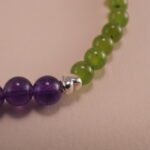 Close-up showing green chalcedony and deep purple amethyst beads