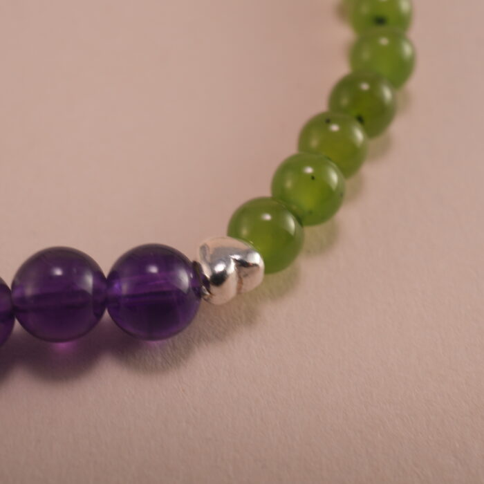 Close-up showing green chalcedony and deep purple amethyst beads
