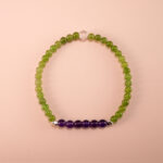 Handmade green chalcedony and amethyst bracelet on white background