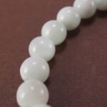 Close-up of 6mm Kunzite and Chalcedony beads – soft colors and smooth texture