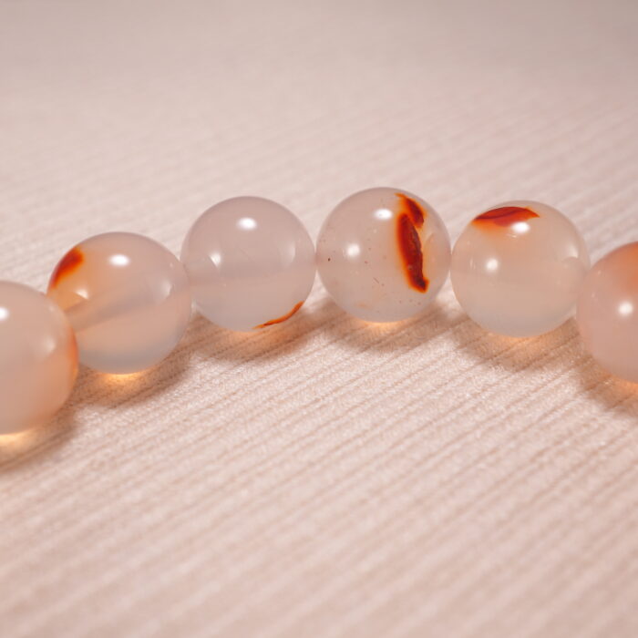 Close-up view of 10mm beads with crystal clarity and polish