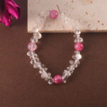 Crystal bracelet styled on neutral-toned fabric