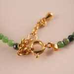 Close-up of Ruby Zoisite stones in round polished beads