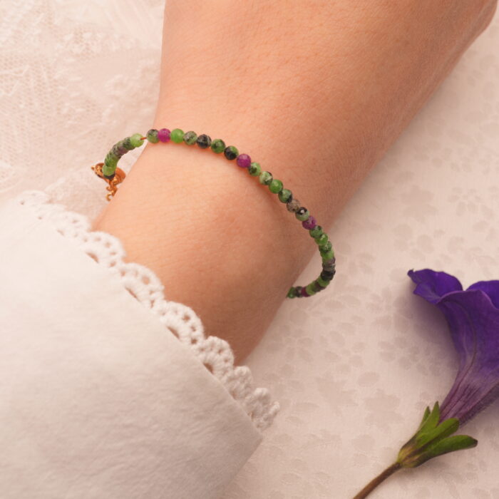 Wrist shot of the Ruby Zoisite handmade bracelet being worn