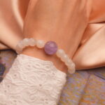 Handmade white agate and amethyst 8mm sterling silver bracelet on white background