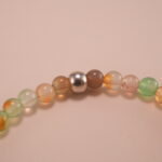 Close-up of 4mm chalcedony beads and star charm detail