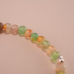 Close-up of 4mm chalcedony beads and star charm detail